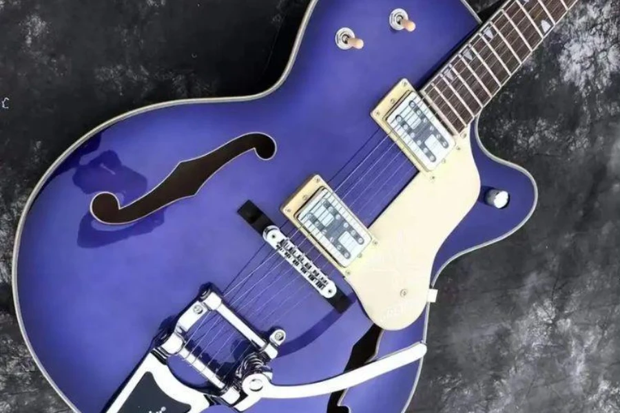 A blue hollow body electric guitar