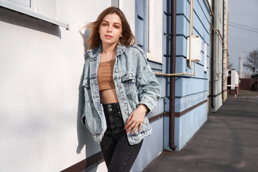 a bralette with oversized denim jacket