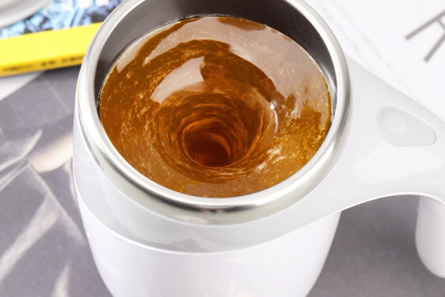 a cup of coffee in a self-stirring mug