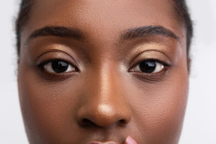 a dark-skinned woman with curly hair