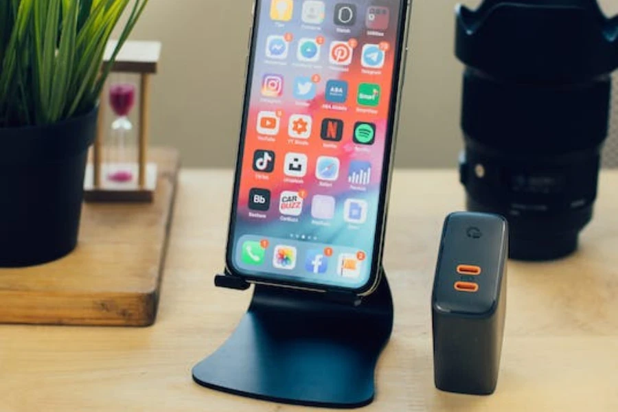 a foldable phone holder next to charging brick