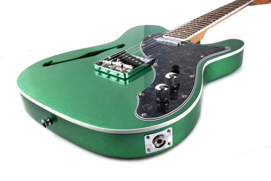 A green semi-hollow body electric guitar