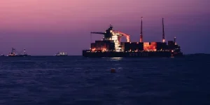 A large cargo ship in the middle of the ocean