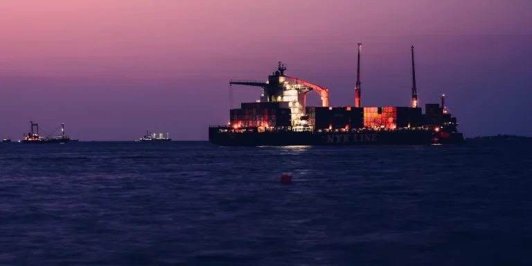 A large cargo ship in the middle of the ocean