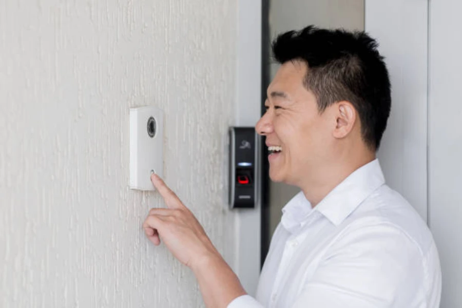 A man communicating using a smart doorbell