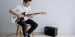 A man playing an electric guitar