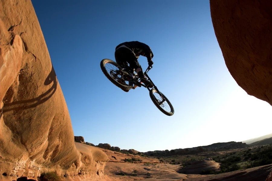 a man riding on a mountain bike downhill