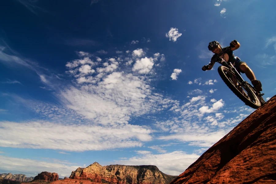 a panorama of a man riding on a mountain bike