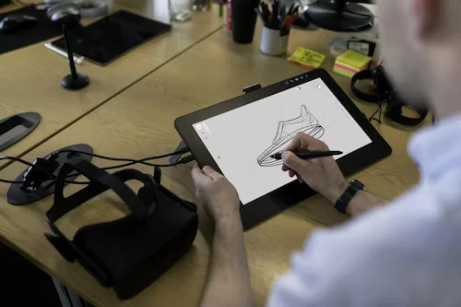 A person using a display drawing tablet