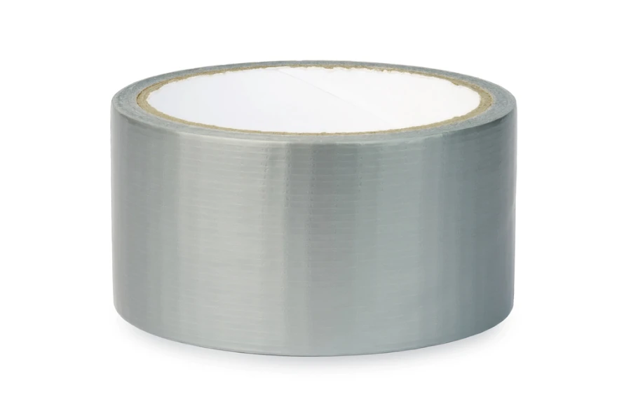 A roll of aluminum metal adhesive tape on white background