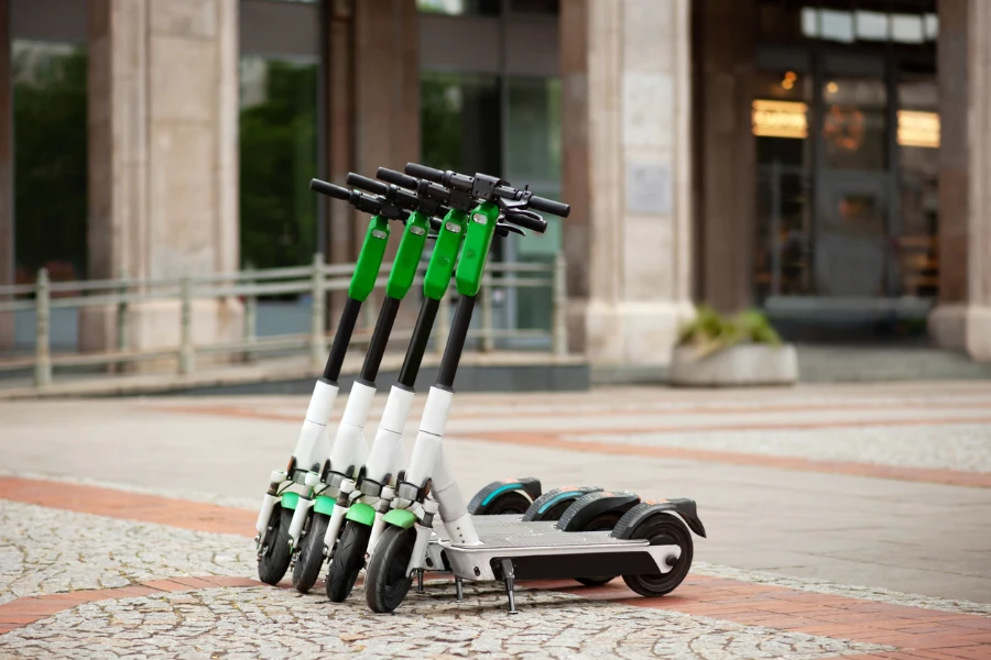 a row of electric scooters on city street