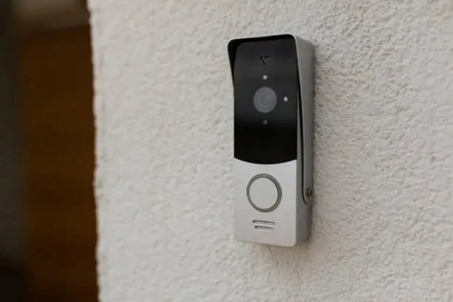 A silver colored smart doorbell