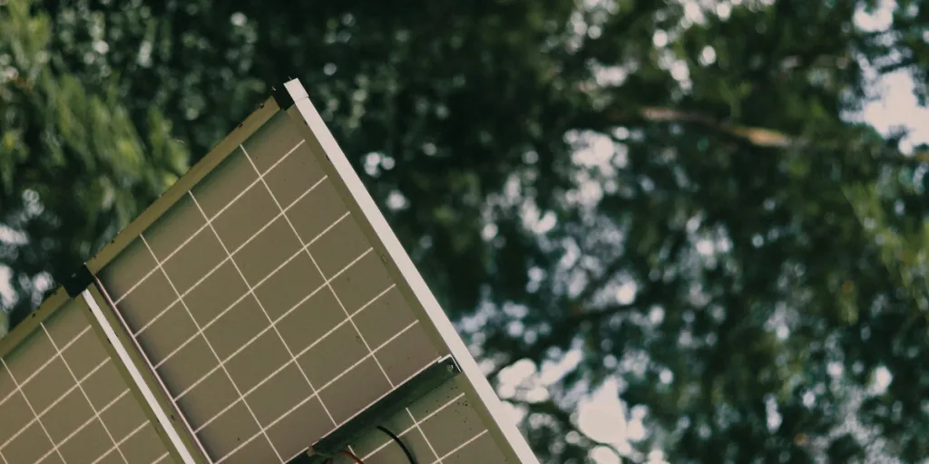 a solar panel in the middle of the forest