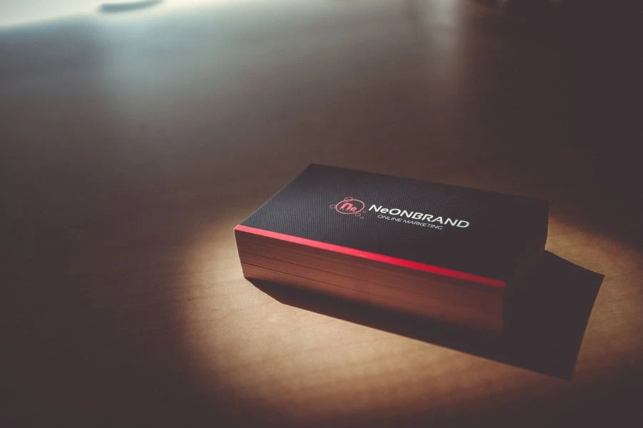 A stack of black and red business cards