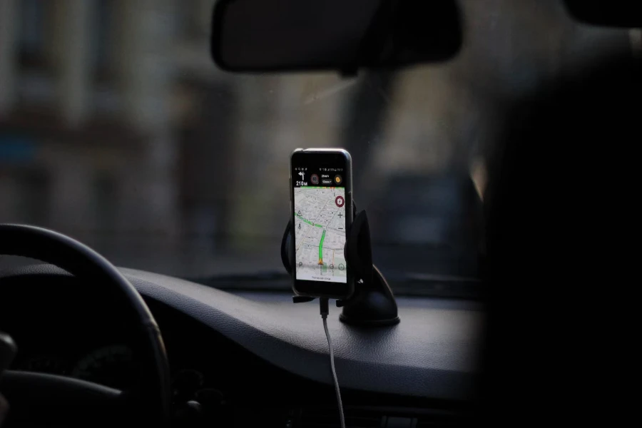 a suction cup car phone stand with a GPS map