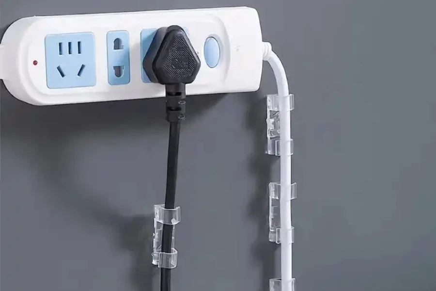 A wall-mounted socket with cable organizers