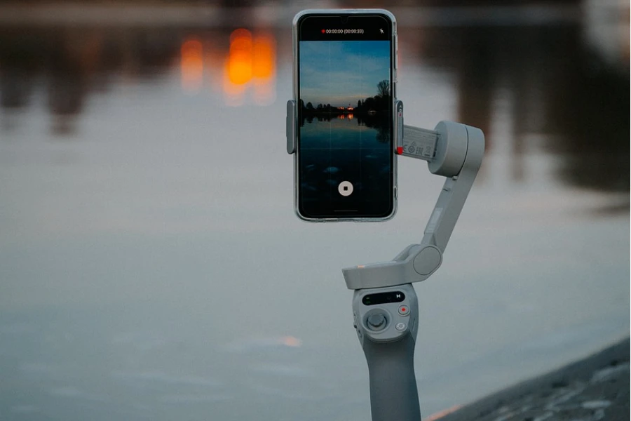 a white gimbal stabilizer phone stand