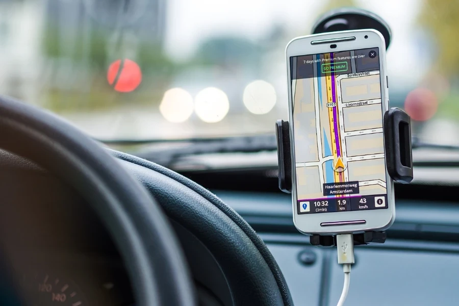 a white phone in a car phone holder