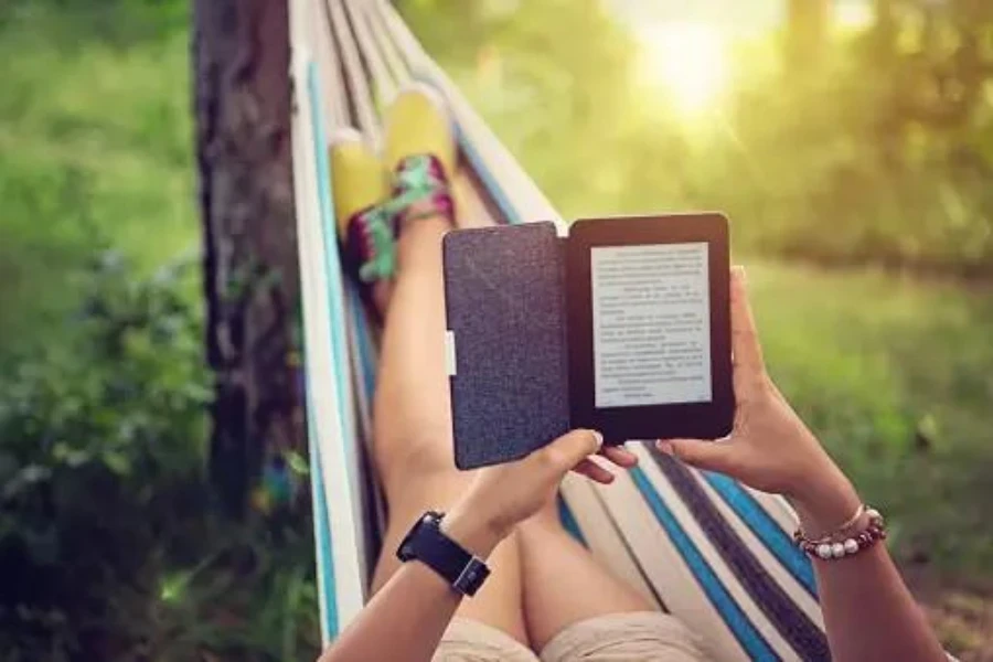 A woman reading an ebook accessed from an ebook store on an e-reader