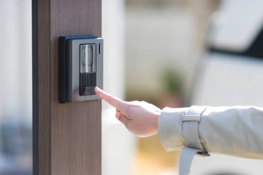 An anonymous person ringing a durable smart doorbell