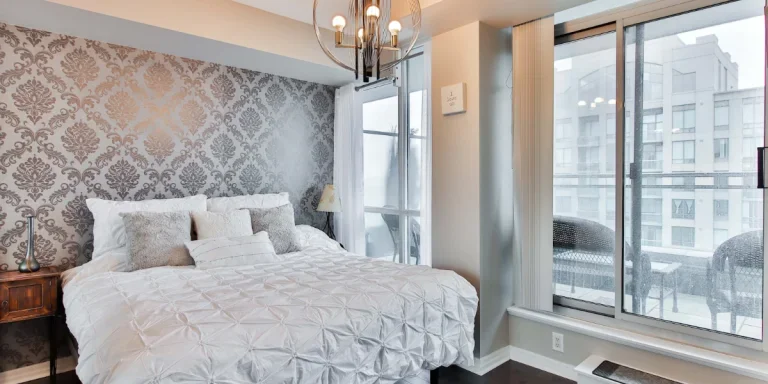 Apartment bedroom with patterned stick & peel wallpaper