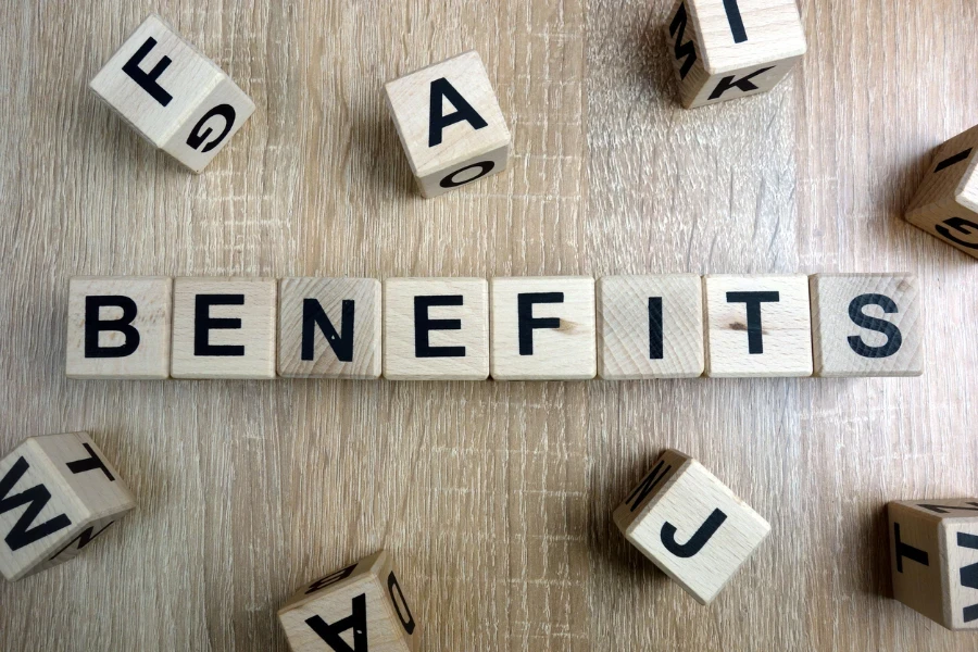 benefits word from wooden blocks on desk