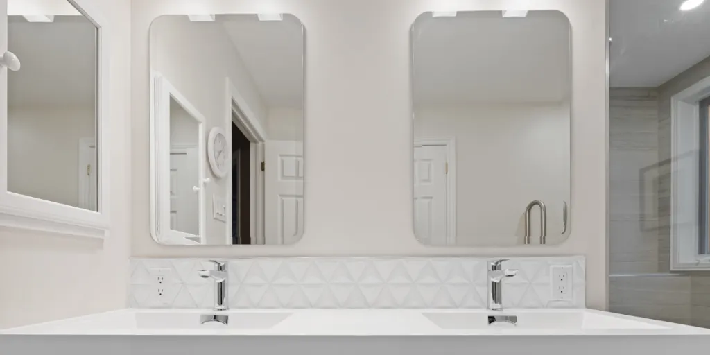 Double sink vanity with rectangular beveled edge bath mirrors