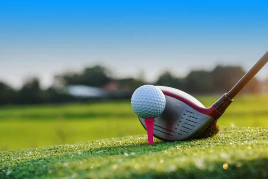 Driver lined up to hit golf ball on golf tee