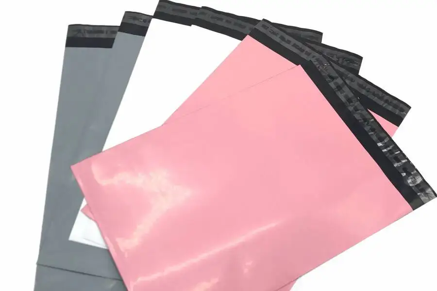Gray, white, and pink bio-plastic mailing bags