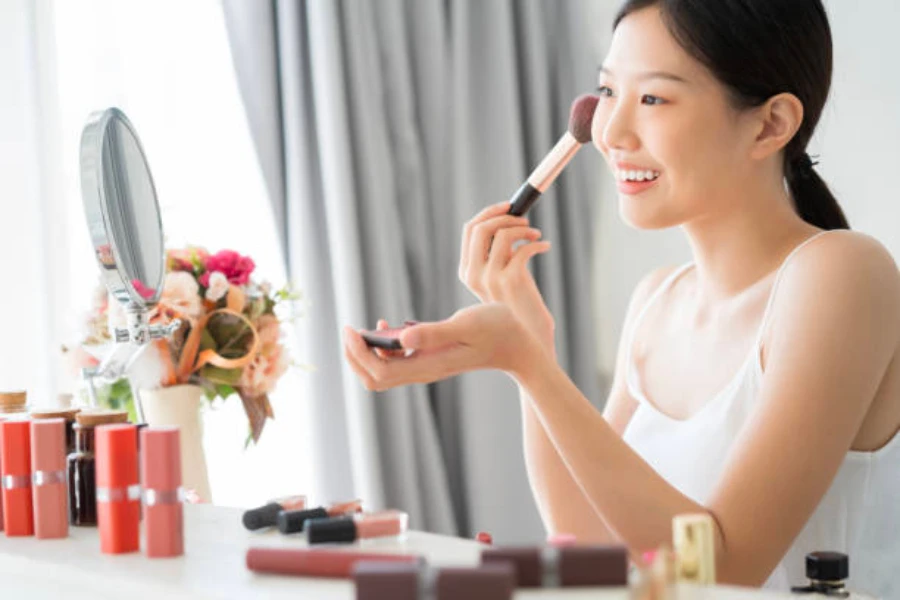 Korean woman putting on makeup