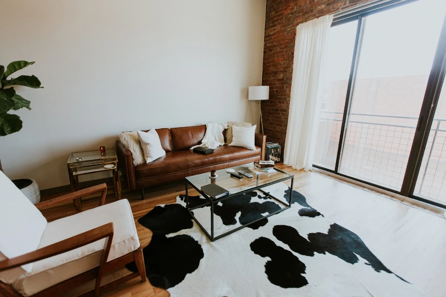 Living space with white and black cowhide rug