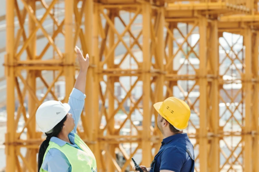 man and woman looking up at a construction site