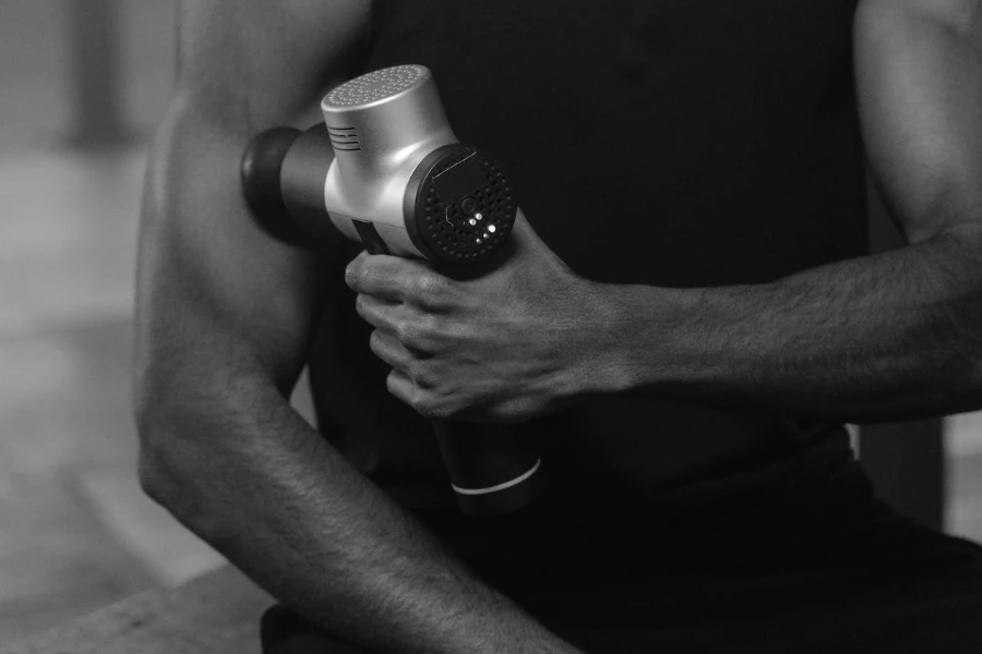 massage gun is important equipment to create a home gym