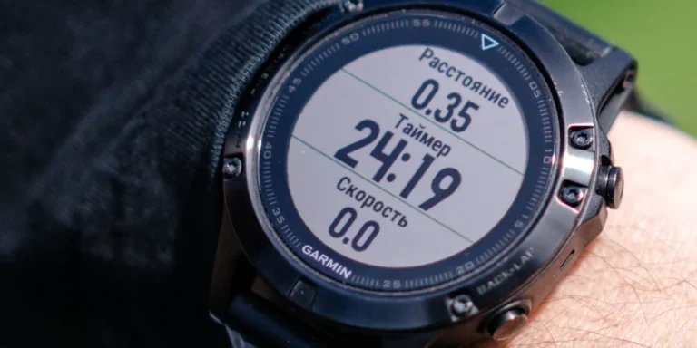 person looking at a black sports watch