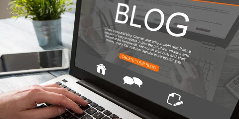 Person setting up a new blog on a laptop