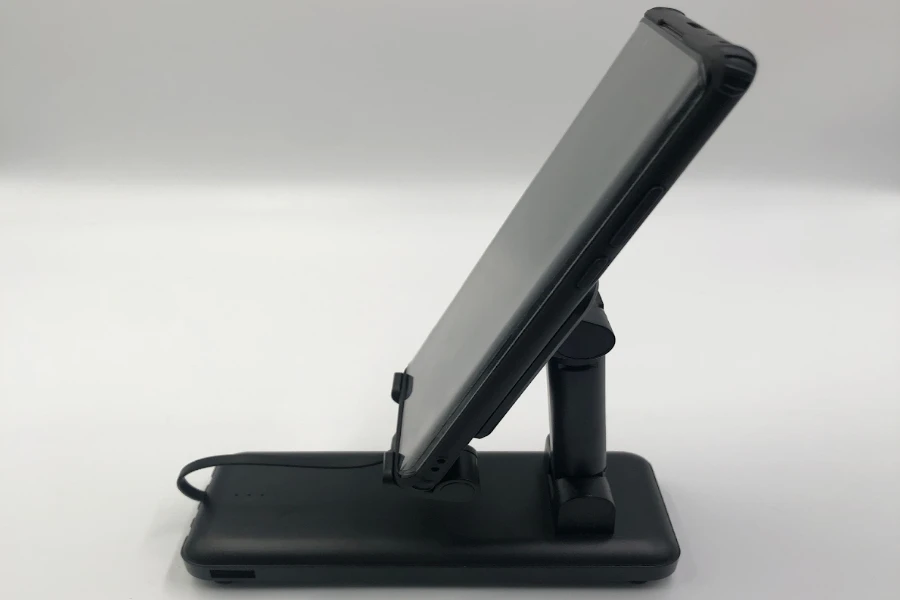 Phone on a black power bank charging stand