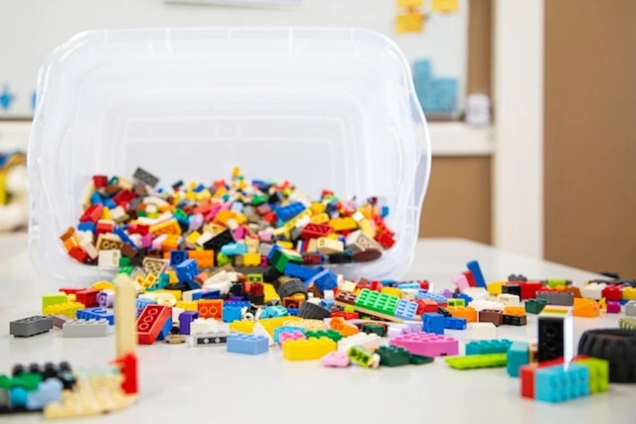 Plastic building blocks pouring from a white container
