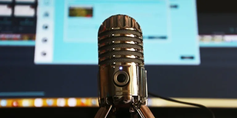 selective focus photography of gray stainless steel condenser microphone