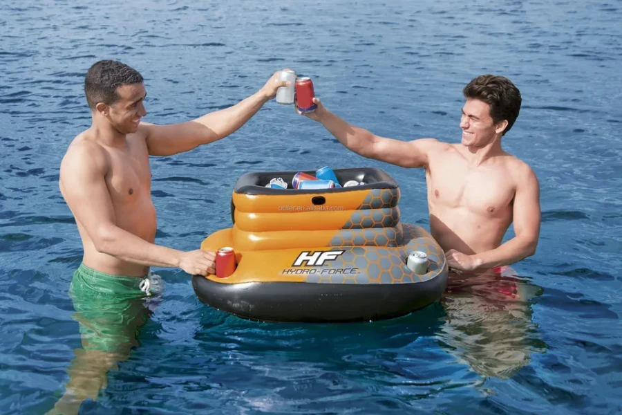 Two men cheersing beer cans with a floating cooler
