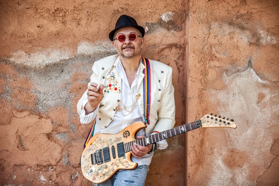 Older man with customized electric guitar in Middle East