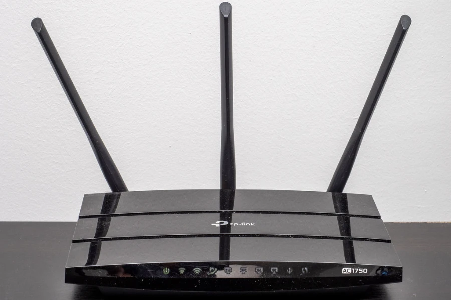 A black router with three antennas