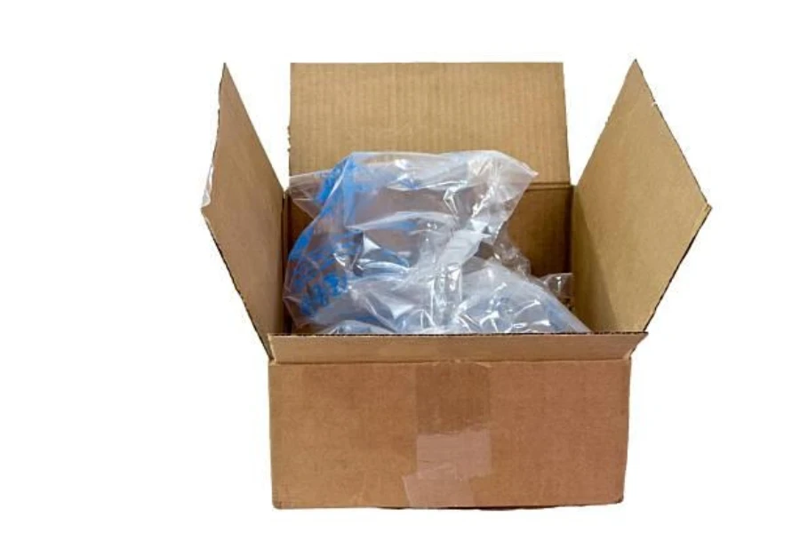 A cardboard box of air pillows against a white background