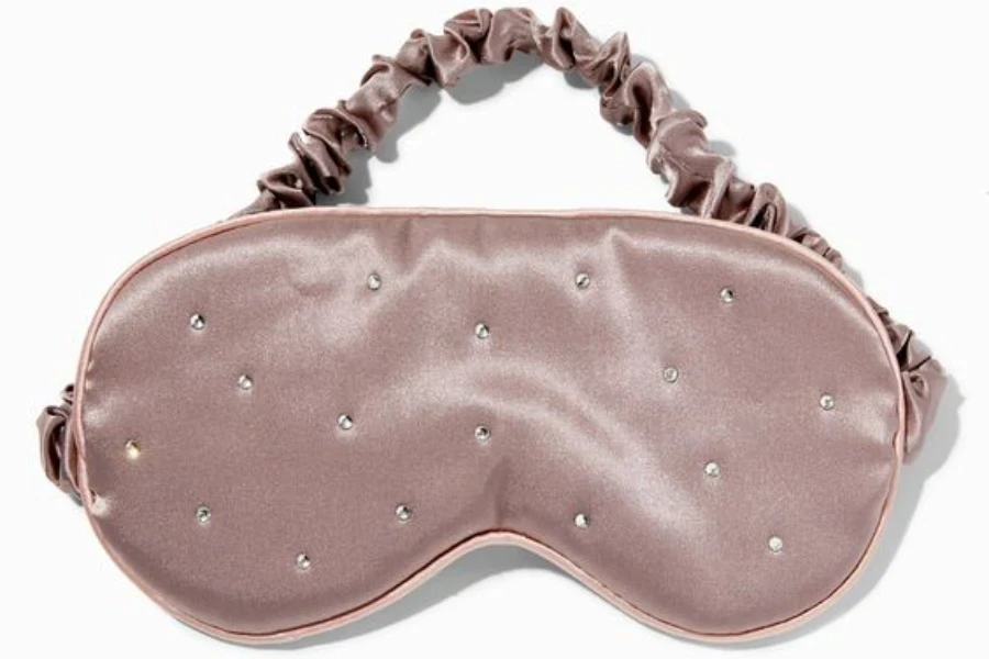 A contoured eye mask made with silk fabric