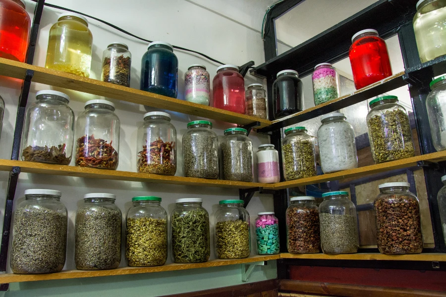 A corner spice rack with different spices