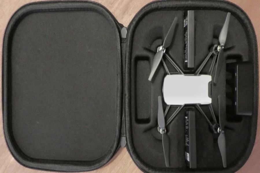 A drone and battery in a black carrying case
