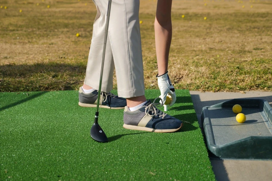 A golf player in spikeless golf shoes