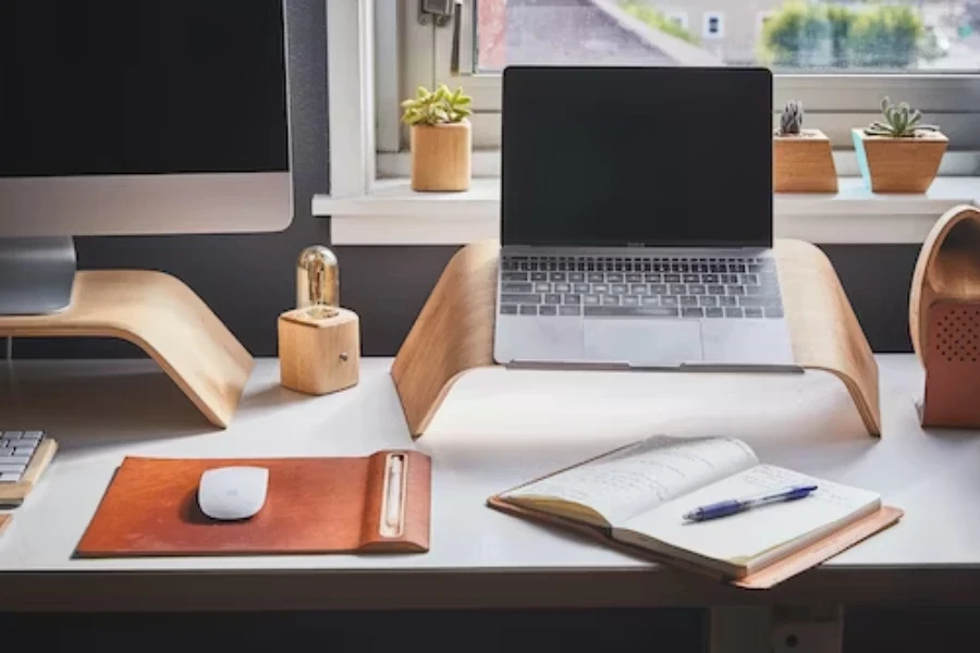 A home office desk setup with wooden desktop stand