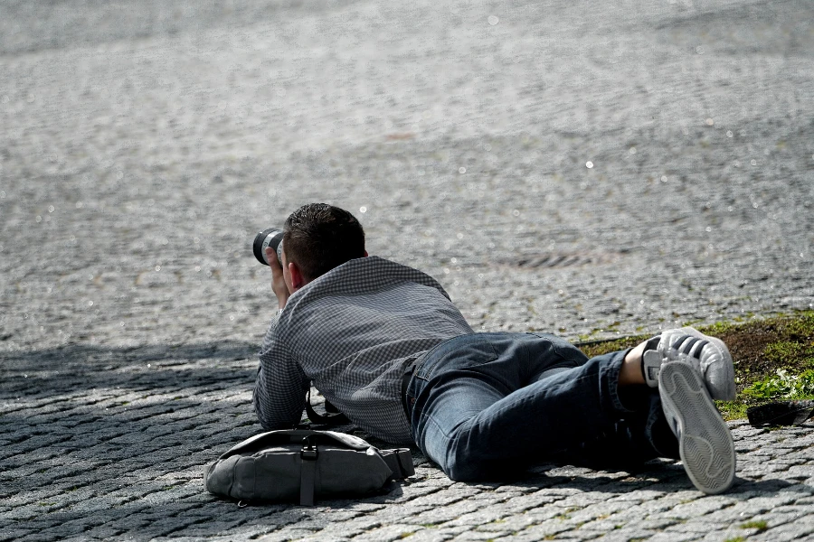 A photographer shooting on a street