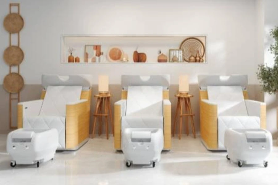 A set of white portable pedicure chairs