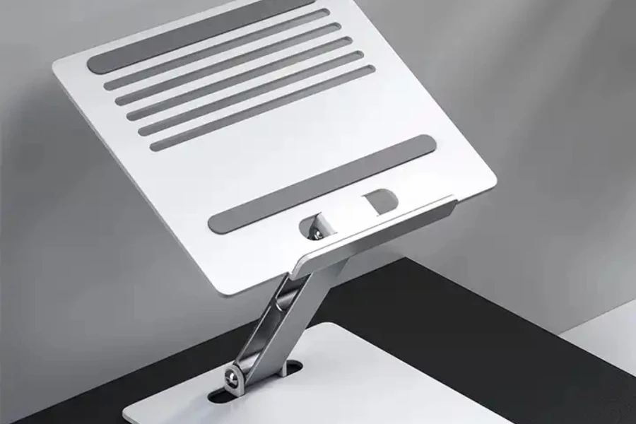 A silver adjustable stand with ventilation holes